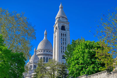 Low angle view of building against blue sky