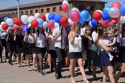 Group of people on balloons