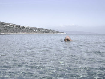 Man swimming in sea