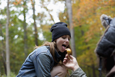 Young couple hanging out in the forest