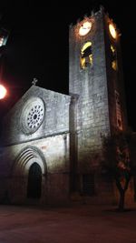 Low angle view of church lit up at night