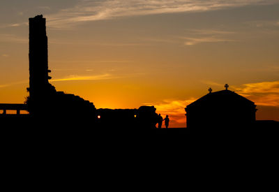 Silhouette of building during sunset