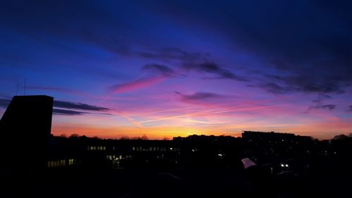 Silhouette of built structures at sunset