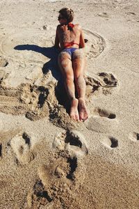 Full length of woman standing on beach