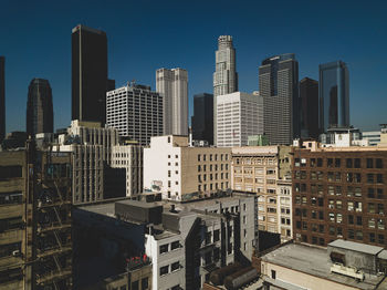 Modern buildings in city against sky