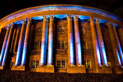 Low angle view of illuminated building at night