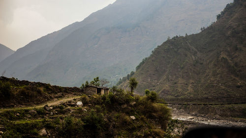 Scenic view of landscape and mountains against sky