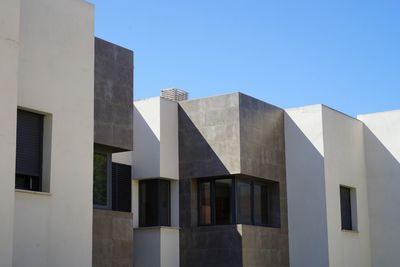 Low angle view of modern building against clear sky