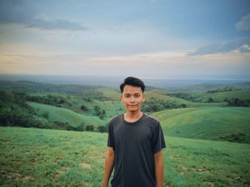 Portrait of man standing on landscape