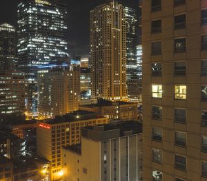 Aerial view of city lit up at night