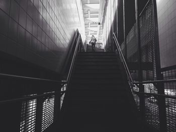 Low angle view of people on staircase