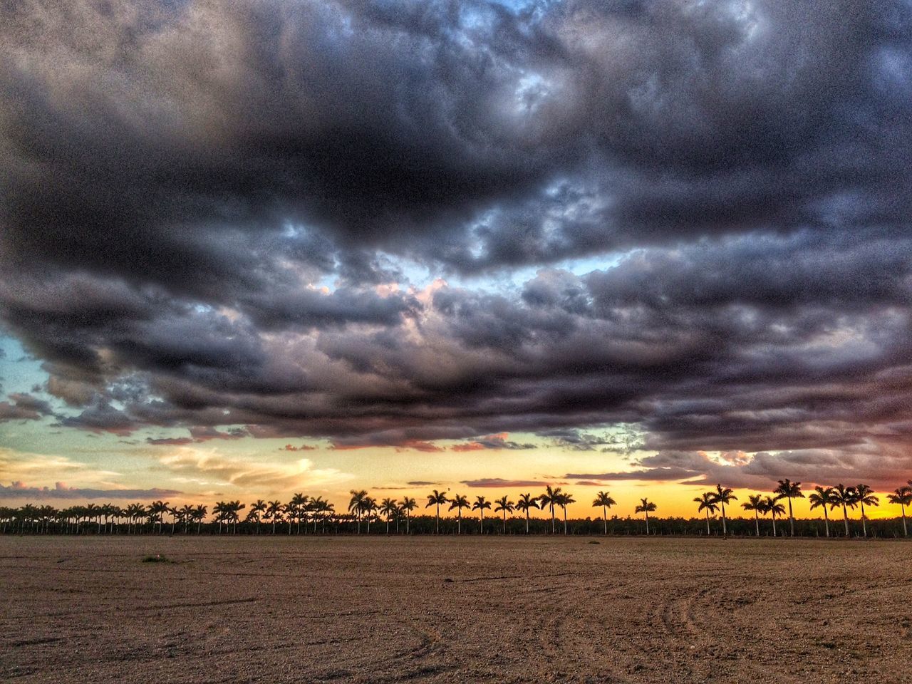 sky, cloud - sky, sunset, cloudy, weather, scenics, dramatic sky, overcast, beauty in nature, storm cloud, tranquil scene, tranquility, atmospheric mood, nature, cloud, idyllic, sea, moody sky, orange color, water