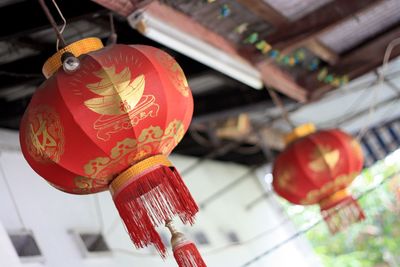 Low angle view of illuminated lanterns hanging