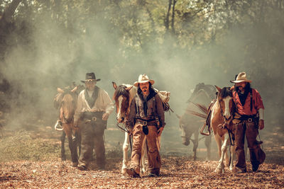 Panoramic view of people walking on land