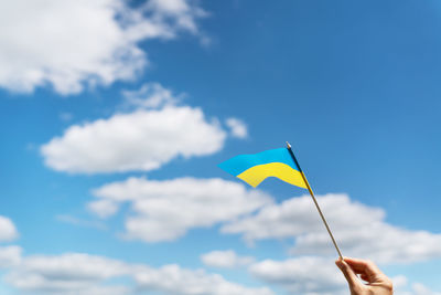 Pray for ukraine. ukrainian national yellow-blue flag against a beautiful sky. 