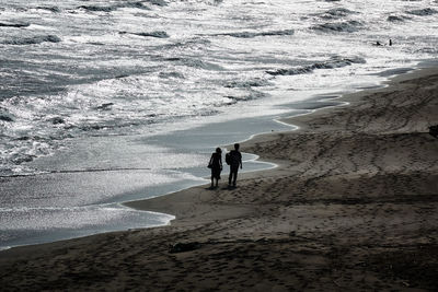 People walking on beach