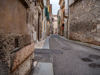 Footpath amidst old building