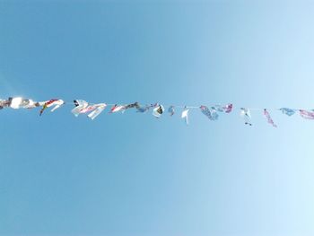 Low angle view of decoration hanging against sky