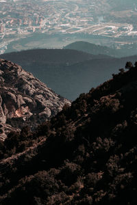 High angle view of trees and mountains against sky