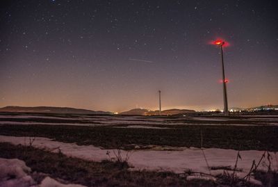 Scenic view of field against sky at night