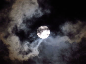 Low angle view of moon against sky at night