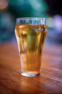 Close-up of beer glass on table