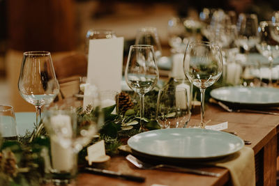 Close-up of wineglasses on table