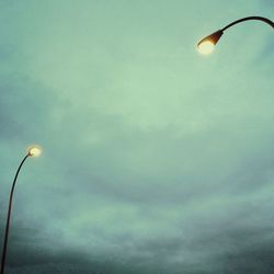 Low angle view of street light against sky