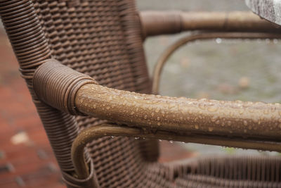 Close-up of wet wicker chair