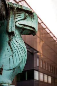 Close-up of statue against building