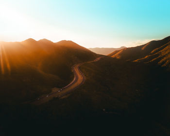 Scenic view of mountains against sky during sunset