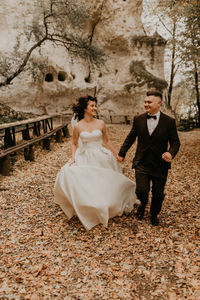 Portrait of couple standing on field