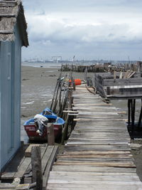 Pier over sea against sky