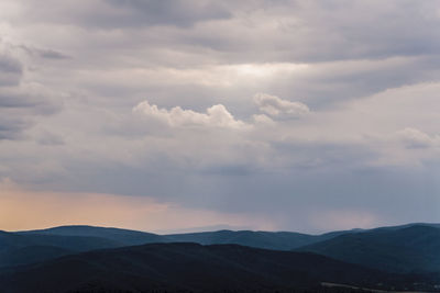 Scenic view of mountains against sky during sunset