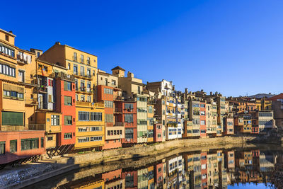 Residential buildings against blue sky