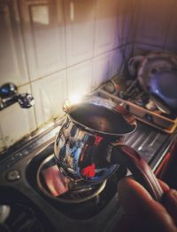High angle view of person hand on table at home