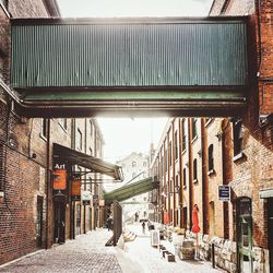 Alley amidst buildings in city