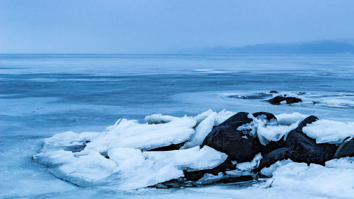 Scenic view of frozen sea against sky