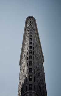 Low angle view of skyscraper against clear sky