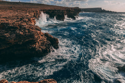 Scenic view of sea against cloudy sky