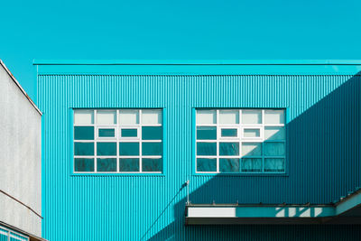 Low angle view of building against blue sky