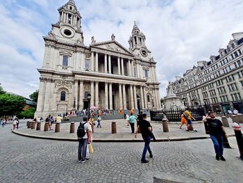 People walking on street at st paul's cathedral
