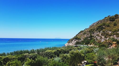 Scenic view of sea against clear blue sky