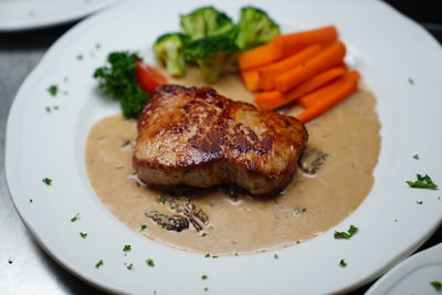 Close-up of meat served in plate on table