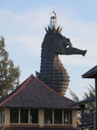 Low angle view of statue against building