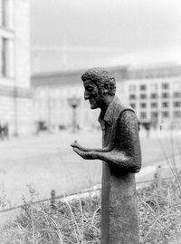 Close-up of statue against building