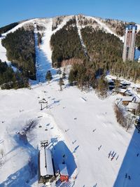 High angle view of snow covered land and mountains