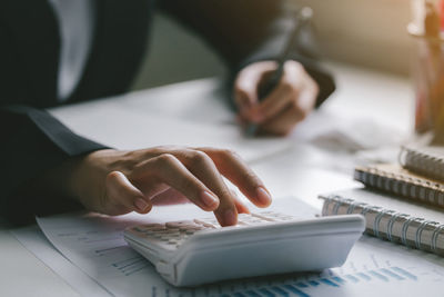 Business financing accounting banking concept.woman hand doing finances and calculate about cost 