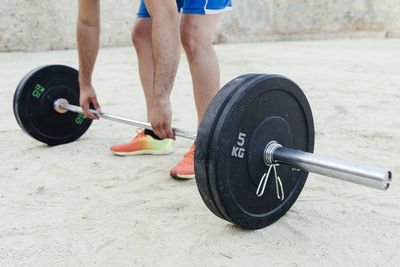 Close up of legs and arms of a sportsman doing urban crossfit