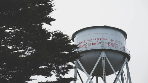 Low angle view of water tower against clear sky